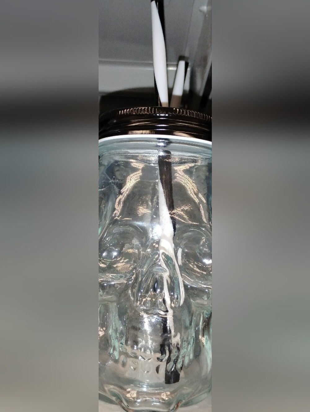 Glass Skull Drinking Jar with Black Lid and a Black & White Striped Straw